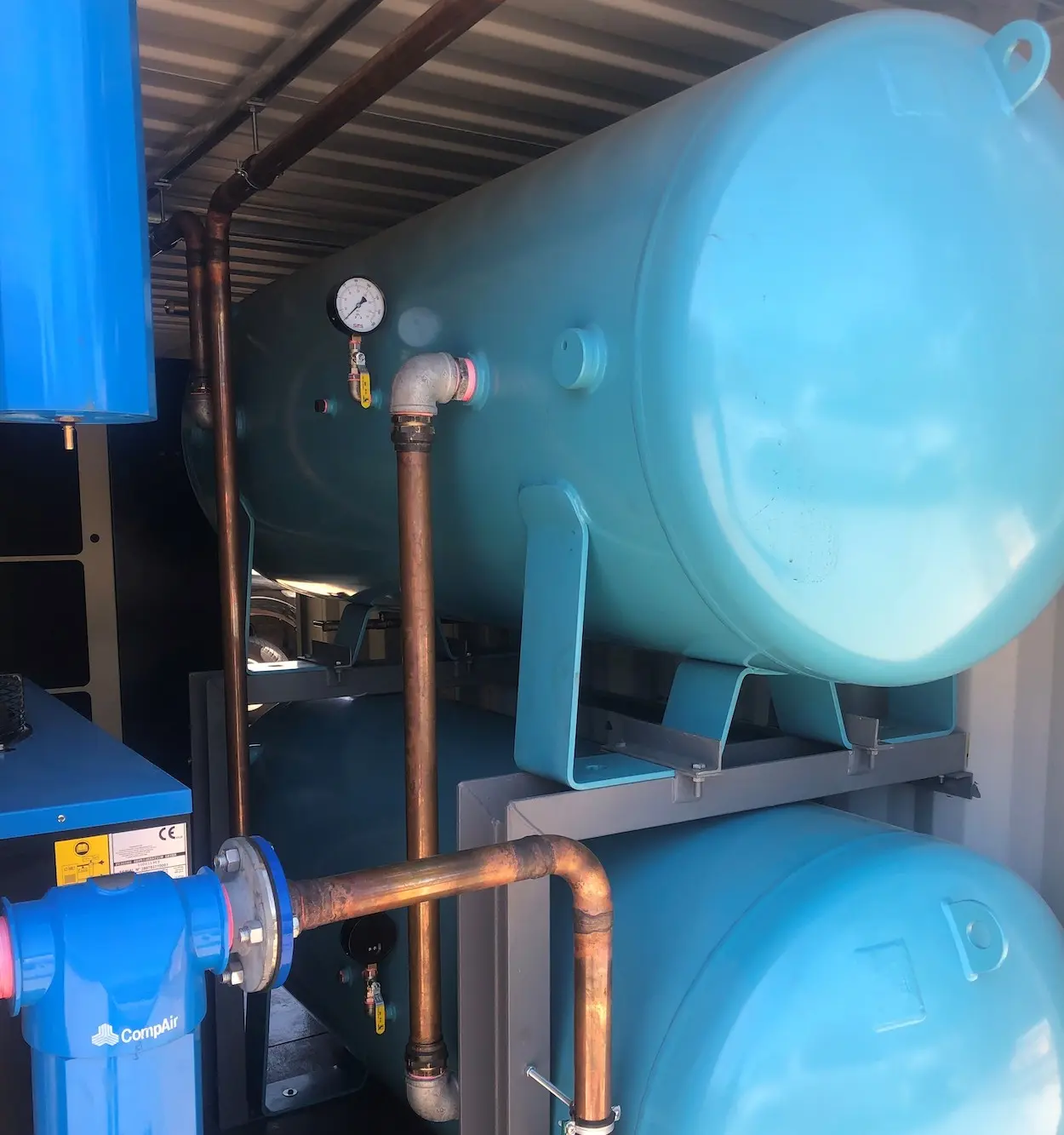 A compressed air unit with piping fitted by Industrial Medical Piping Systems.